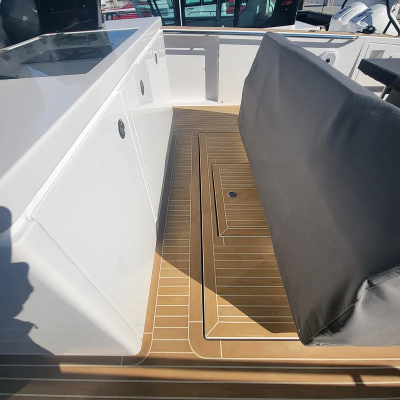 Slide: The Image of Interior view of 2022 Pardo Yachts 38, featuring sleek cabinetry and teak flooring. - 29