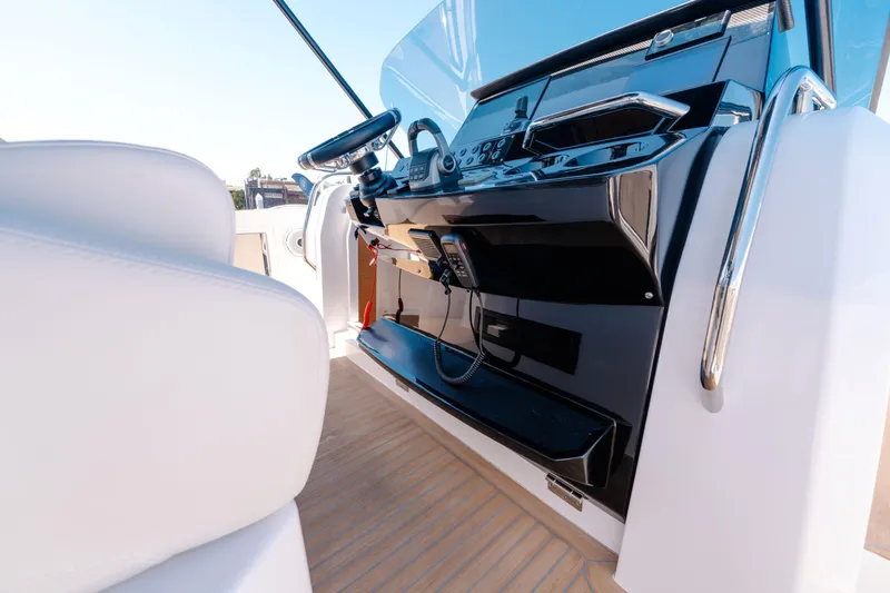Slide: The Image of Helm of 2022 Pardo Yachts 38, featuring sleek controls and modern design. - 7