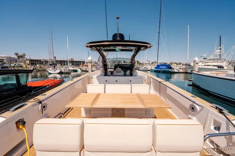 Slide: The Image of 2022 Pardo Yachts 38 at marina, featuring spacious deck and elegant seating. - 13