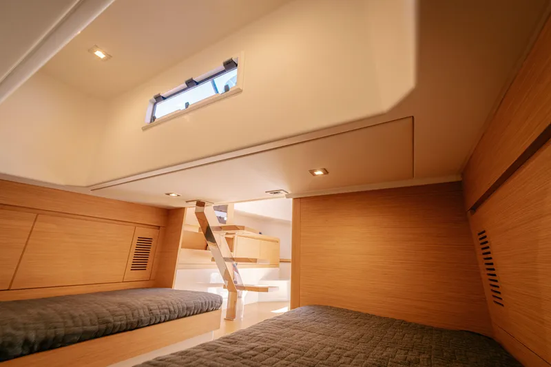 Slide: The Image of Interior cabin of 2022 Pardo Yachts 38, featuring modern wood finish and cozy sleeping area. - 18