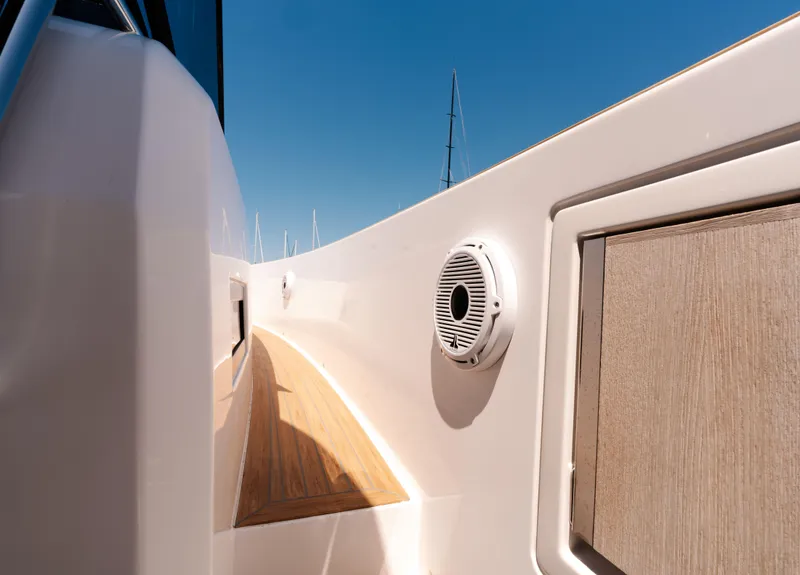 Slide: The Image of Pardo Yachts 38 (2022) deck view with speaker and wooden paneling. - 21