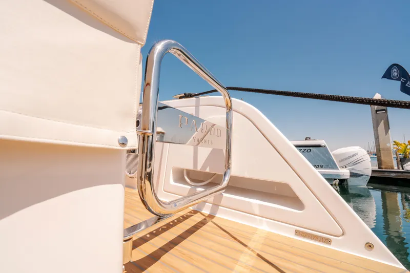 Slide: The Image of 2022 Pardo Yachts 38, sleek design, docked with chrome details and wooden deck. - 22