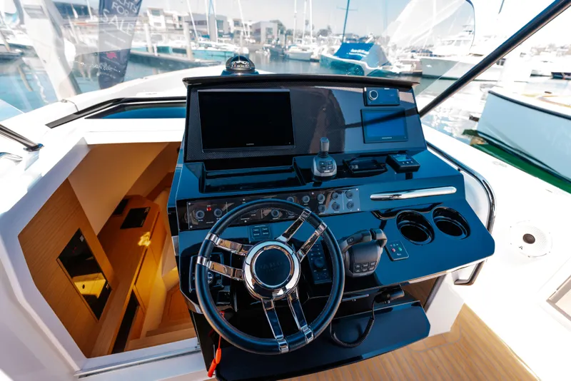 Slide: The Image of Helm of 2022 Pardo Yachts 38 with modern controls and navigation equipment. - 23