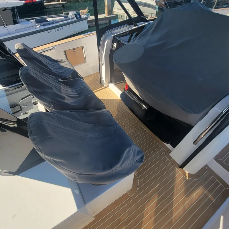 Slide: The Image of 2022 Pardo Yachts 38 interior with covered seating and sleek design. - 30