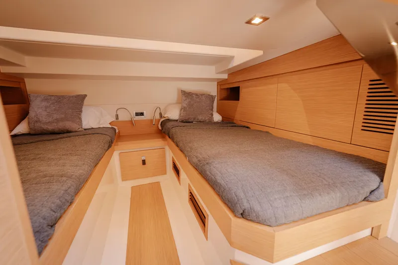 Slide: The Image of Interior cabin of 2022 Pardo Yachts 38 with twin beds and modern wood finish. - 34