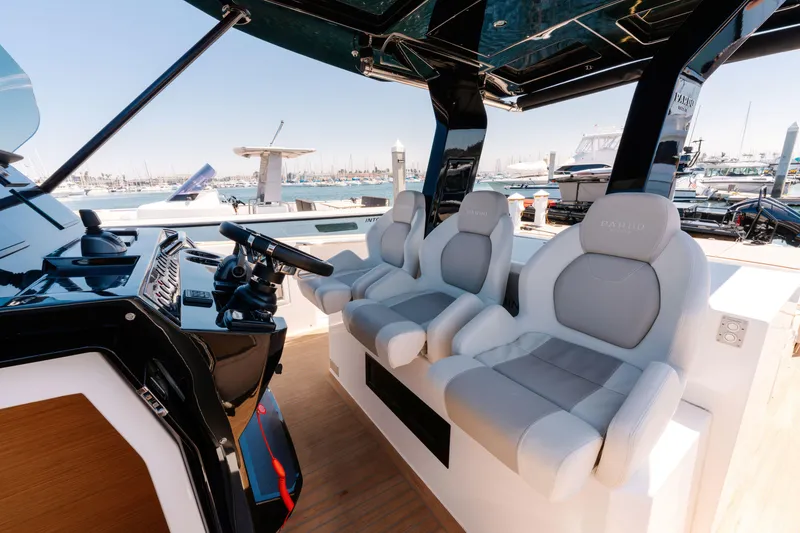 Slide: The Image of 2022 Pardo Yachts 38 interior with modern helm and plush seating at marina. - 6