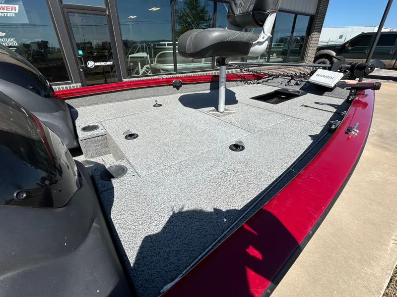 Slide: The Image of 2018 Tracker 175TWX boat deck with seating and equipment, displayed outdoors. - 10