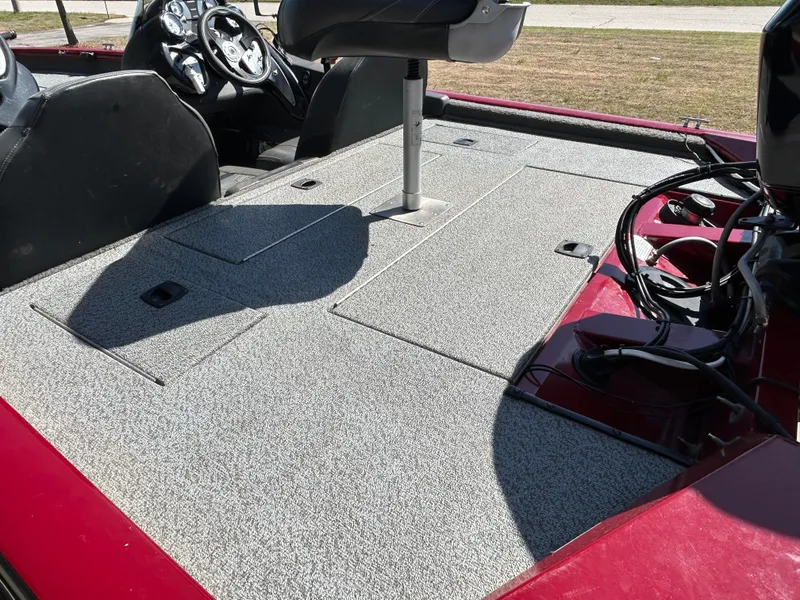Slide: The Image of 2018 Tracker 175TWX boat interior with gray carpet and steering console. - 7