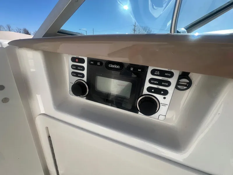 Slide: The Image of 2011 Chaparral 264 Sunesta boat stereo system with Clarion controls and display. - 16