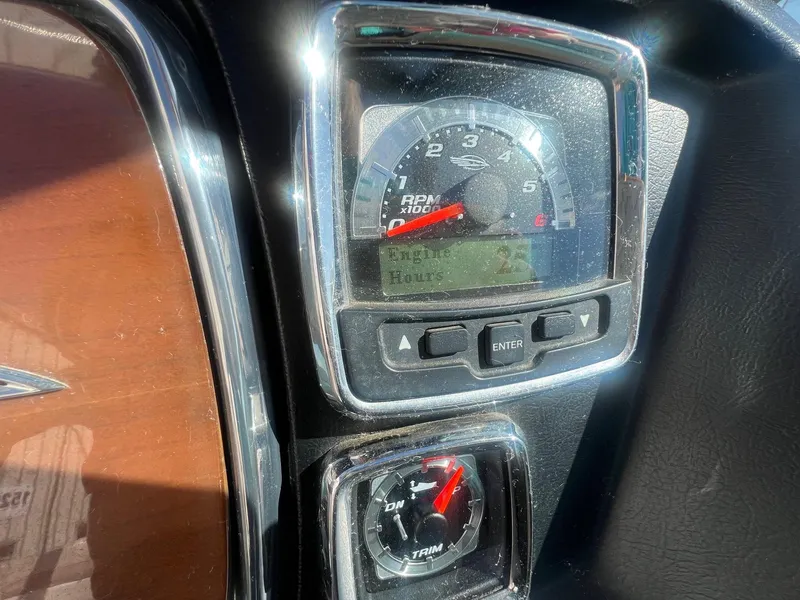 Slide: The Image of Dashboard of 2011 Chaparral 264 Sunesta showing RPM and engine hours. - 20