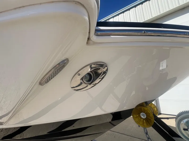 Slide: The Image of 2011 Chaparral 264 Sunesta boat detail, showing hull and metal fittings. - 3