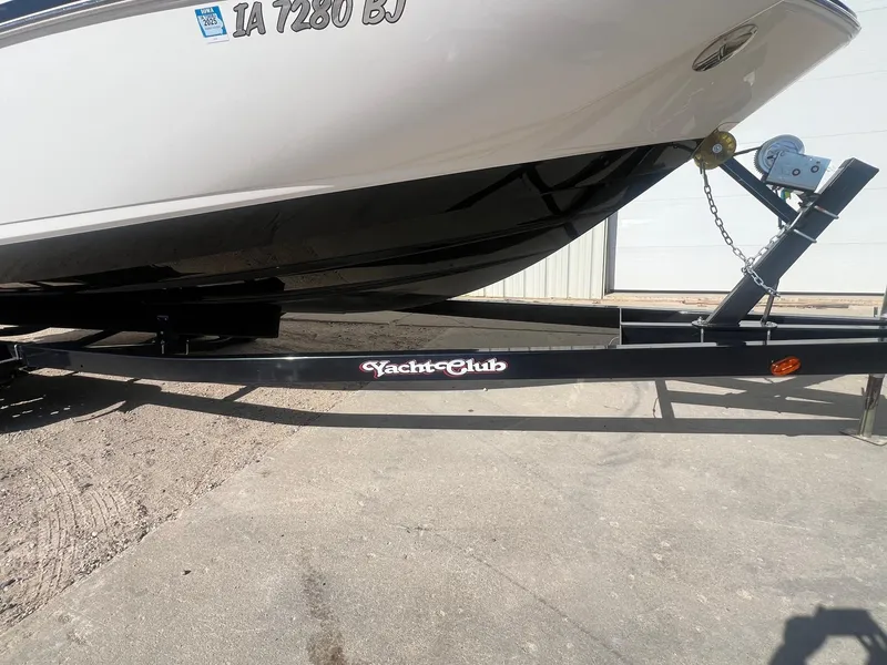 Slide: The Image of 2011 Chaparral 264 Sunesta boat on Yacht Club trailer, parked on concrete. - 37