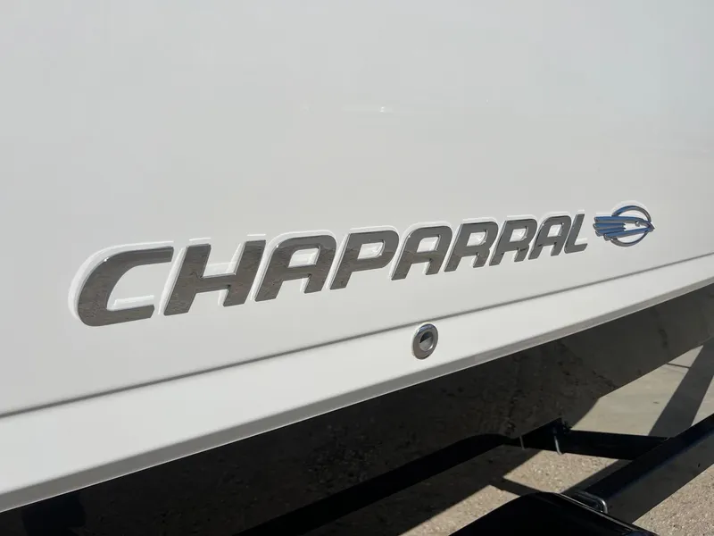 Slide: The Image of Chaparral 264 Sunesta 2011 logo on white boat exterior. - 4