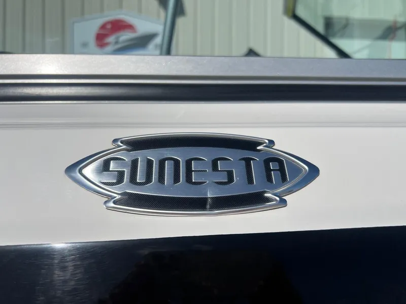 Slide: The Image of 2011 Chaparral 264 Sunesta logo on boat exterior, close-up view. - 5