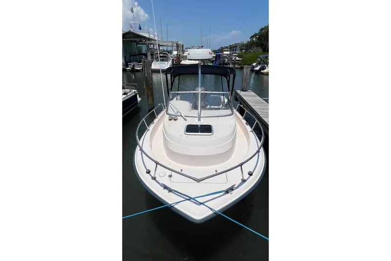 Slide: The Image of 2005 Grady-White Seafarer 226 boat docked at marina, front view. - 3