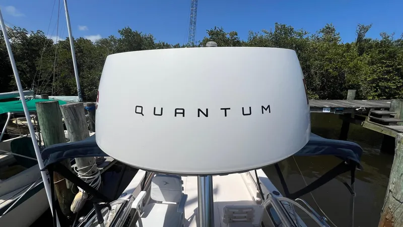 Slide: The Image of 2005 Grady-White Seafarer 226 boat with "Quantum" radar, docked near trees. - 30