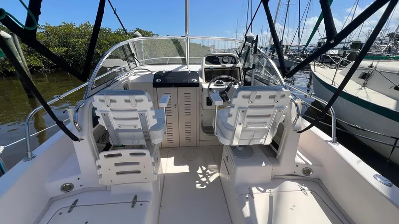 Slide: The Image of 2005 Grady-White Seafarer 226 boat interior with dual seats and steering console. - 7