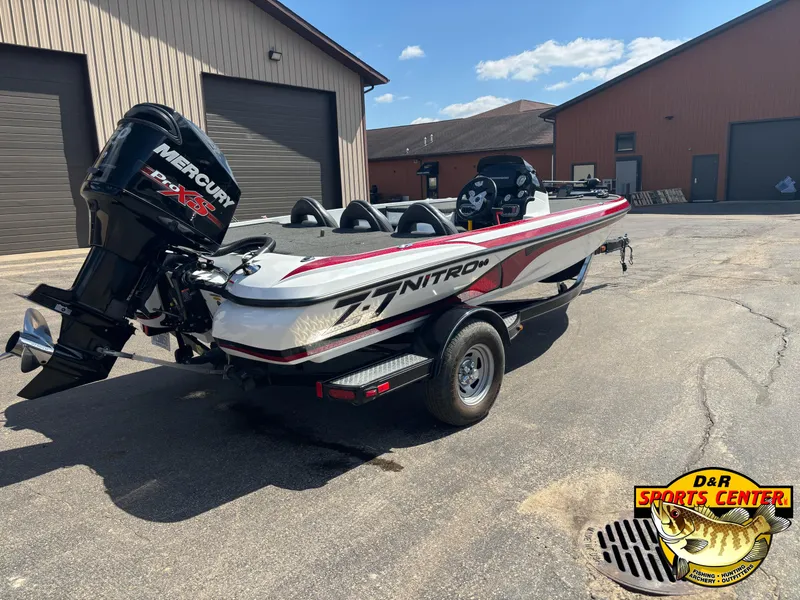 Slide: The Image of 2014 Nitro Z-7 boat with Mercury engine parked outside D&R Sports Center. - 2