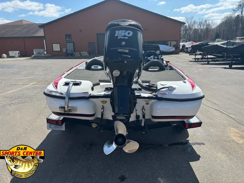 Slide: The Image of 2014 Nitro Z-7 boat with 150 Pro engine, parked outdoors at D&R Sports Center. - 3