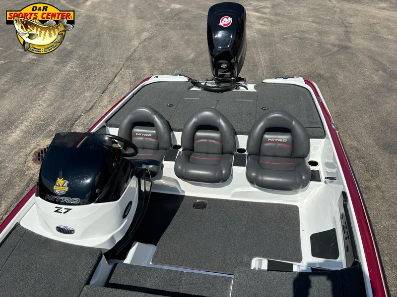 Slide: The Image of 2014 Nitro Z-7 boat interior with three seats and motor, displayed at D&R Sports Center. - 4
