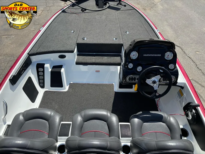 Slide: The Image of Interior of a 2014 Nitro Z-7 boat with steering console and seating. - 5