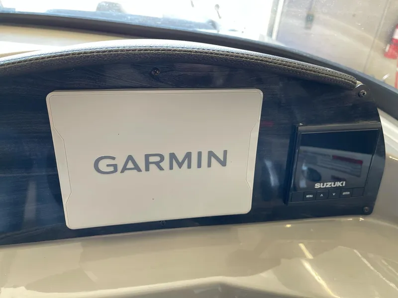 Slide: The Image of Dashboard of 2022 Stingray 231 DC with Garmin and Suzuki displays. - 14