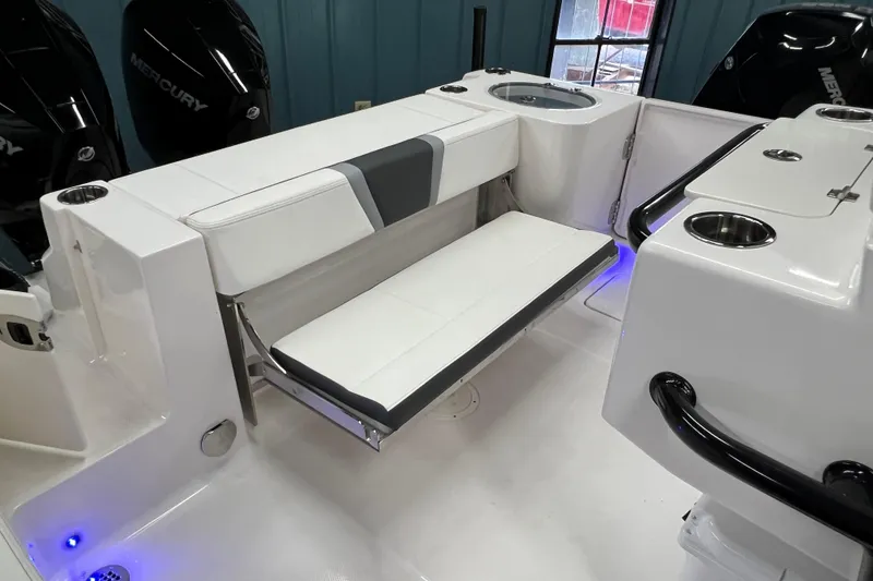 Slide: The Image of 2025 Robalo R250 Center Console boat interior with modern seating and sleek design. - 16