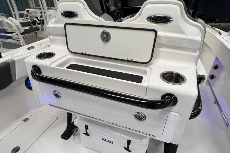 Slide: The Image of 2025 Robalo R250 Center Console boat interior with storage and Yeti cooler. - 19