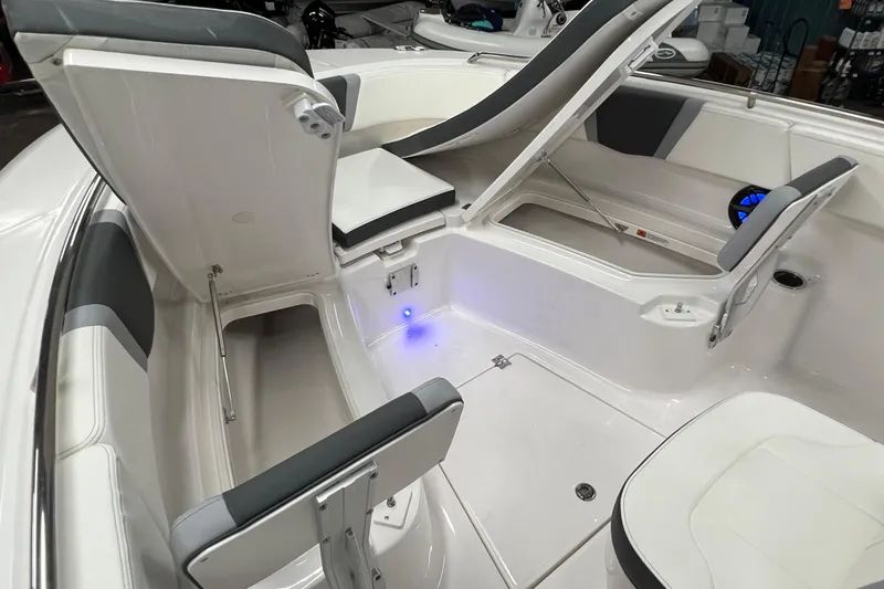 Slide: The Image of 2025 Robalo R250 Center Console boat interior with storage and cup holders. - 20