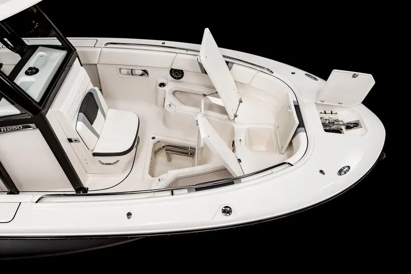 Slide: The Image of 2025 Robalo R250 Center Console interior with advanced electronics and blue speakers. - 7