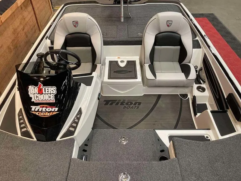 Slide: The Image of 2024 Triton 20XP boat interior with dual seats and steering console. - 7