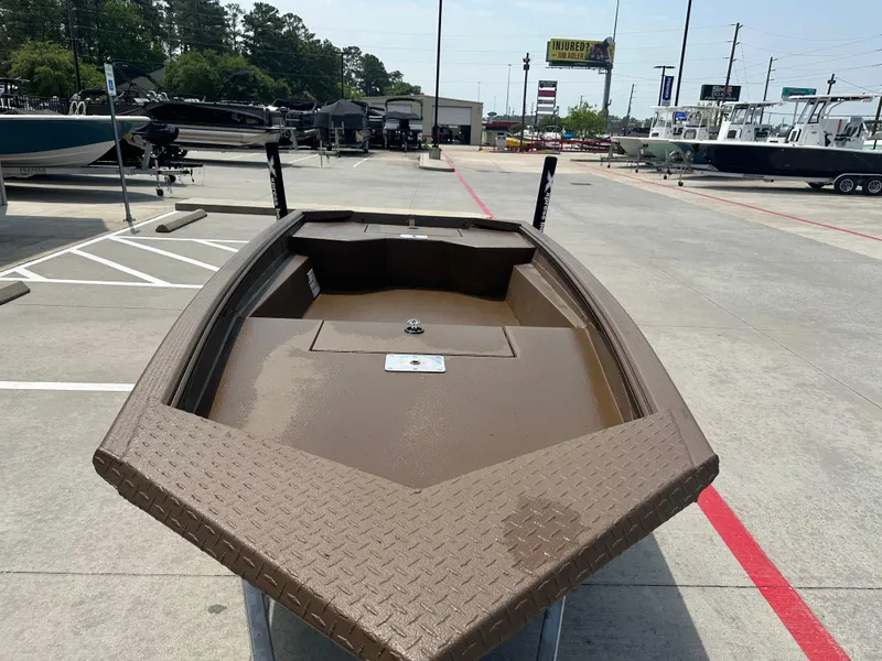 Slide: The Image of 2025 Xpress HD16DBX boat displayed in a dealership parking lot. - 14