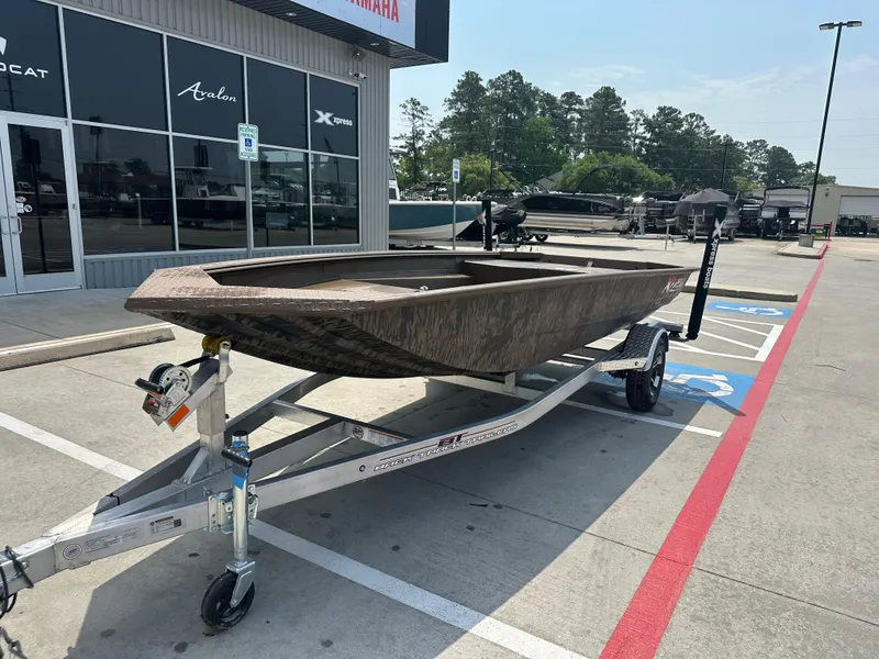 Slide: The Image of 2025 Xpress HD16DBX boat on trailer outside dealership, sunny day. - 3