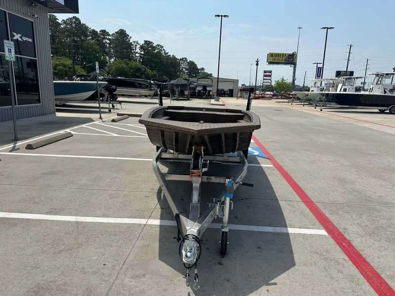 Slide: The Image of 2025 Xpress HD16DBX boat on trailer in dealership parking lot. - 5