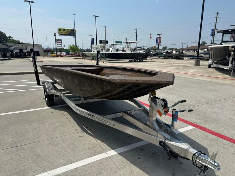 Slide: The Image of 2025 Xpress HD16DBX boat on trailer in parking lot, sunny day. - 6