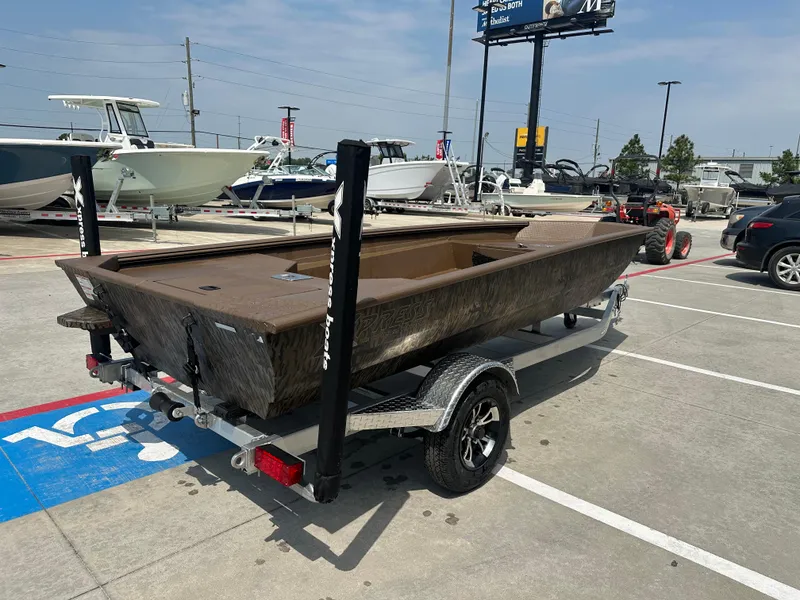 Slide: The Image of 2025 Xpress HD16DBX boat on trailer in parking lot, surrounded by other boats. - 8