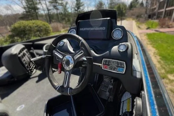 Slide: The Image of 2018 Nitro Z21 boat dashboard with steering wheel and Humminbird display. - 1