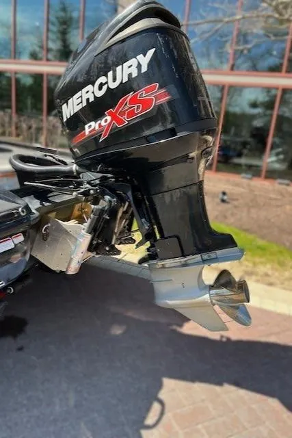 Slide: The Image of 2018 Nitro Z21 with Mercury Pro XS outboard motor, parked outdoors. - 2