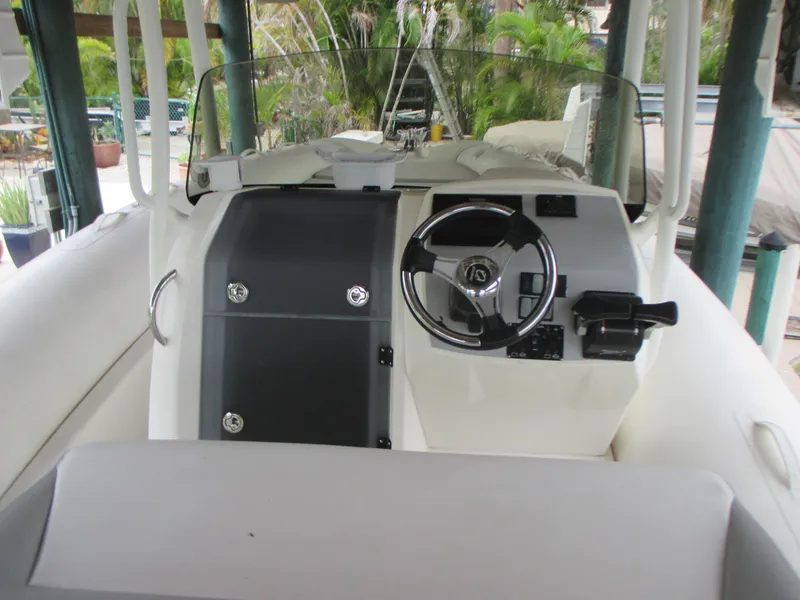 Slide: The Image of 2021 Zodiac NZO 760 boat cockpit with steering wheel and control panel. - 8