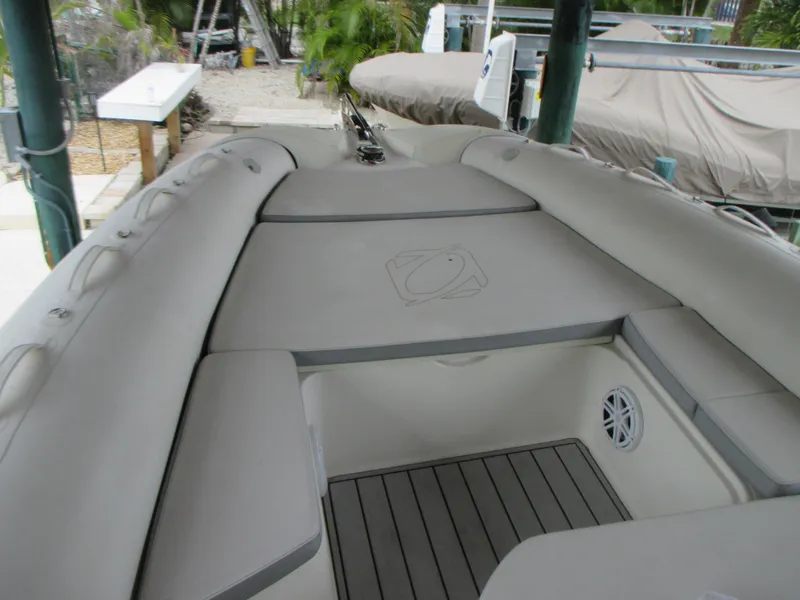 Slide: The Image of 2021 Zodiac NZO 760 boat interior with cushioned seating and storage compartments. - 9