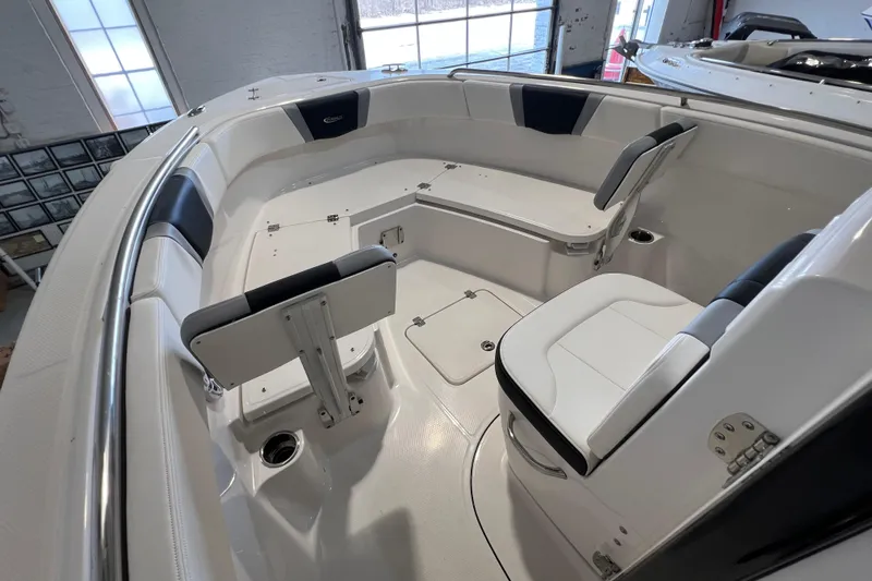 Slide: The Image of 2025 Robalo R230 Center Console boat interior with seating and storage compartments. - 15