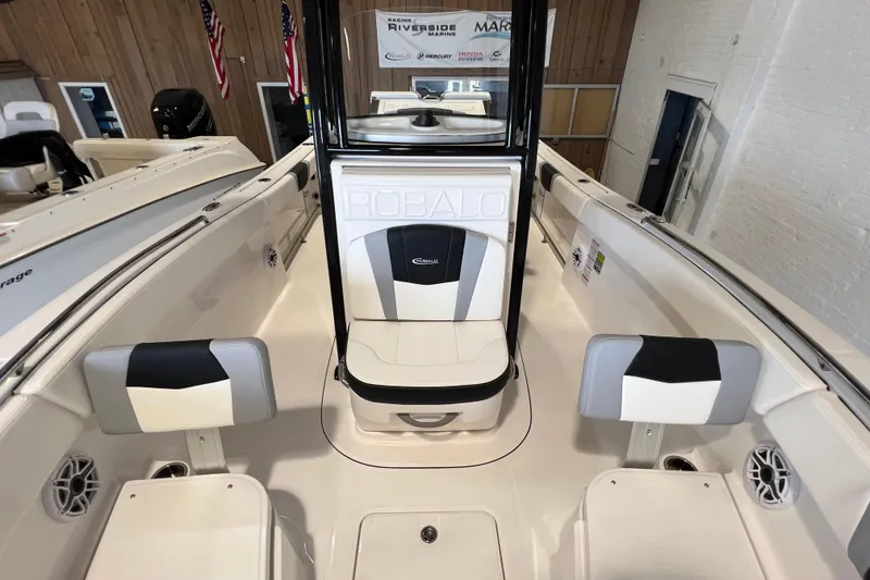 Slide: The Image of 2025 Robalo R230 Center Console boat interior with seating and console details. - 16