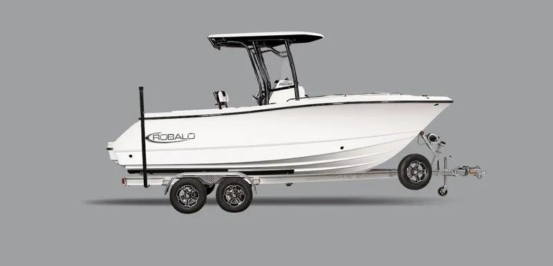 Slide: The Image of 2025 Robalo R230 Center Console boat on trailer, side view, gray background. - 4