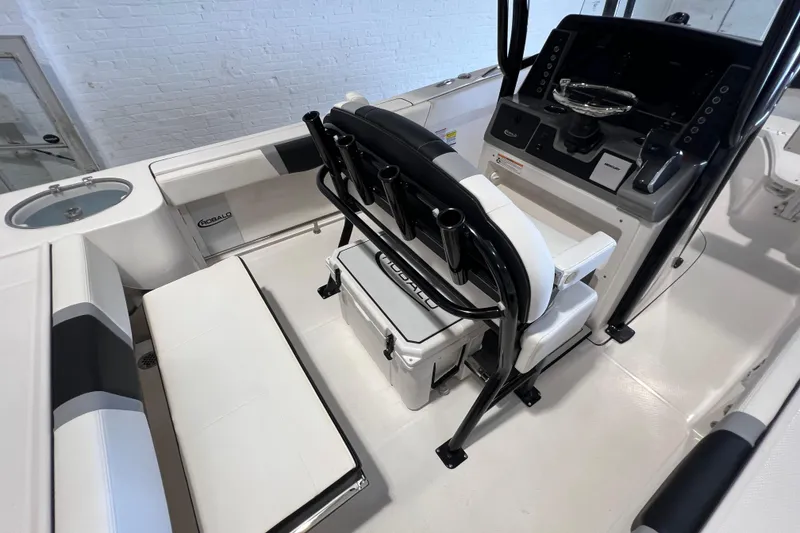 Slide: The Image of 2025 Robalo R230 Center Console boat interior with seating and control panel. - 7
