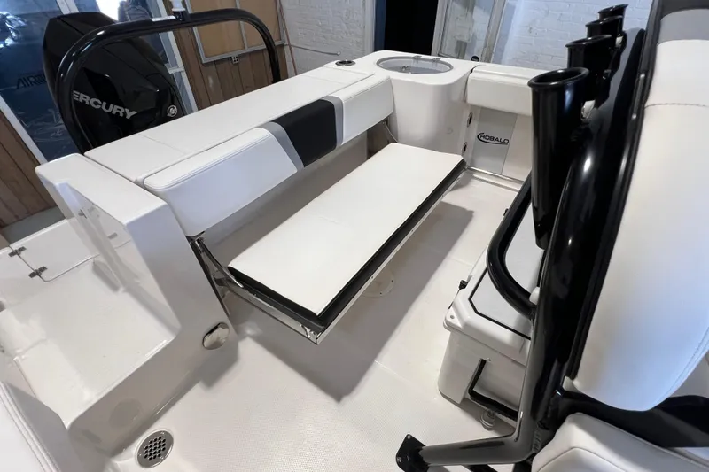 Slide: The Image of 2025 Robalo R230 Center Console boat interior with seating and storage features. - 8