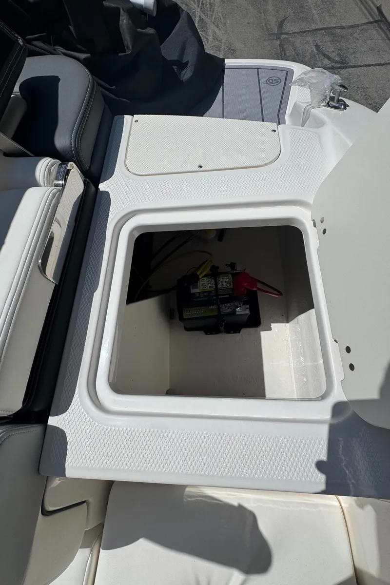 Slide: The Image of Battery compartment of 2024 Chaparral 21 SSi boat. - 12