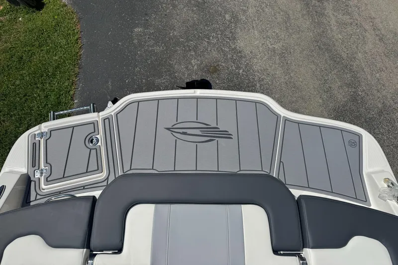 Slide: The Image of 2024 Chaparral 21 SSi boat rear platform with gray padding. - 15