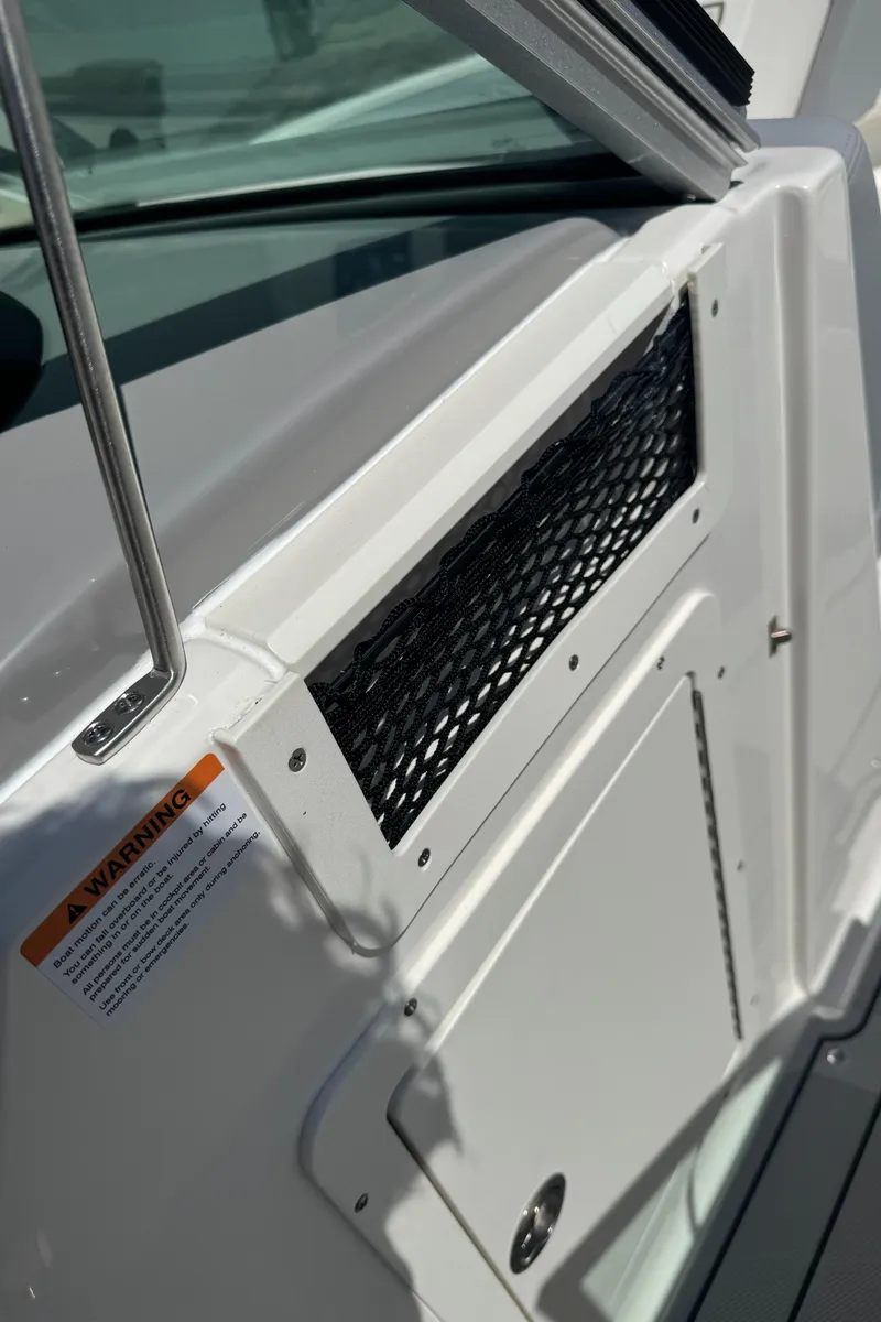 Slide: The Image of Close-up of 2024 Chaparral 21 SSi boat with storage compartment. - 20