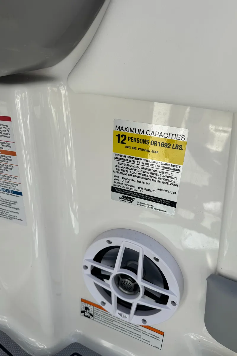 Slide: The Image of Chaparral 21 SSi 2024 boat capacity label and speaker. - 26