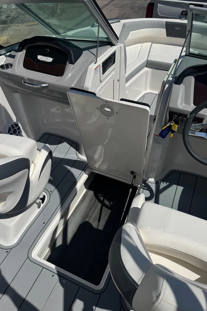 Slide: The Image of Interior of 2024 Chaparral 21 SSi with seating area and helm console. - 28